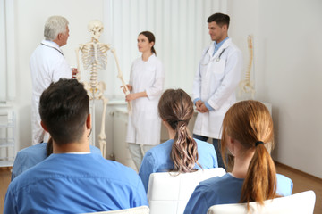 Medical students having lecture in orthopedics at clinic