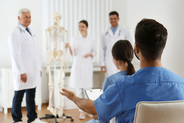 Medical students having lecture in orthopedics at clinic