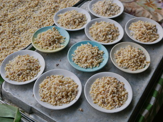 Selective focus of fresh red ant eggs for sale at a small local market in Thailand