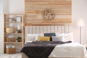 Stylish room interior with big comfortable bed © New Africa