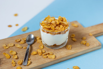 Yogurt bowl with cornflakes. Healthy snack, healthy breakfast