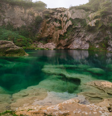 Above and below underwater photo of traditional fishing waterfall in (EL SALTO-EL MECO) san luis...