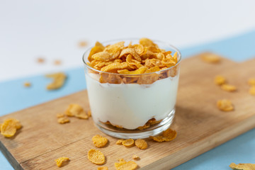 Yogurt bowl with cornflakes. Healthy snack, healthy breakfast