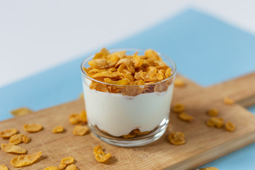 Yogurt bowl with cornflakes. Healthy snack, healthy breakfast