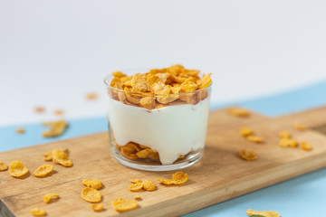 Yogurt bowl with cornflakes. Healthy snack, healthy breakfast