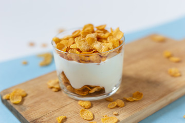 Yogurt bowl with cornflakes. Healthy snack, healthy breakfast