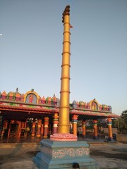 Fototapeta na wymiar Beautiful flag pole in front of a temple