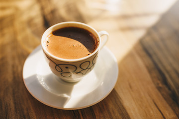 Turkish coffee on a wooden cafe table