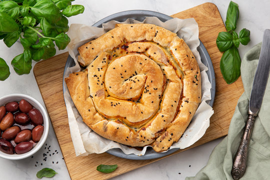 freshly baked Spanakopita,  spiral filo pastry pie with feta cheese and spinach