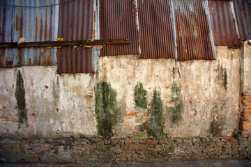 An old wall of many decades With various traces that have deteriorated Occurred on this wall