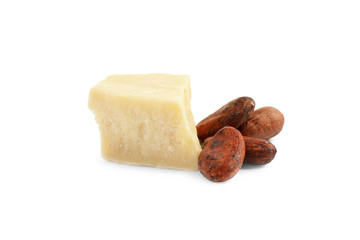 Organic cocoa butter and beans isolated on white