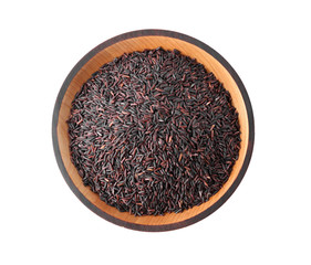 Brown rice in wooden bowl isolated on white, top view