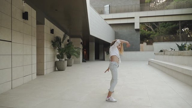 Teenage girl having fun and turn handsprings