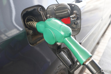 Petroleum Gas station. Fuel pump colorful petrol pump filling nozzles.car at gas station being...