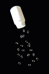 Soft gel capsules on black background
