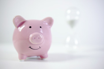 Piggy bank and hourglass, Refers to the period of accumulation of money