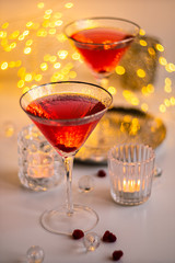 Classic red cocktail in fancy texture glass on bright light bokeh background