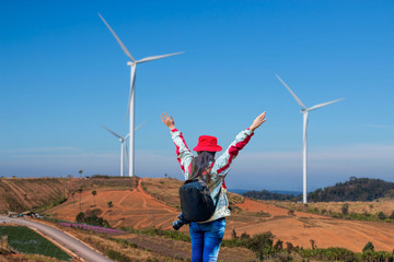 A girl resting on a windmill holiday