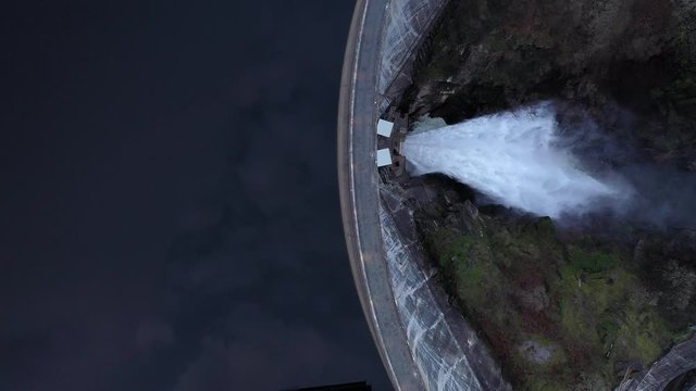 Aerial View Water Pouring Through Large Reservoir