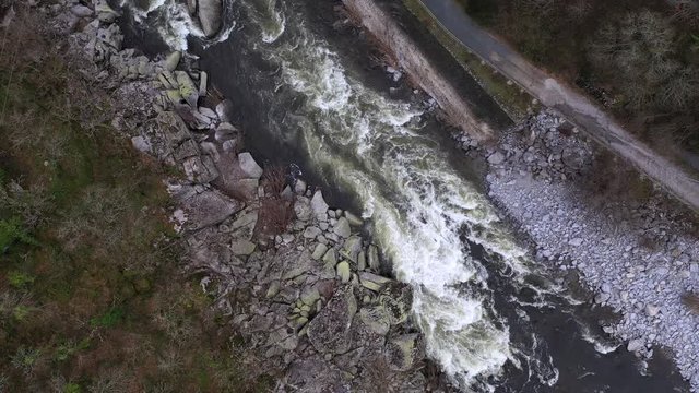 Descending Aerial View into River Rapids in Spain