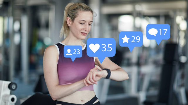 Woman checks social media channels at the fitness center