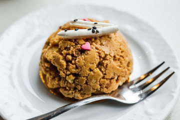 Traditional russian soviet cake muraveynik or funnel cake on a white plate, a dessert fork