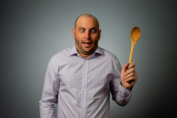 funny bussiness man with wooden spoon 