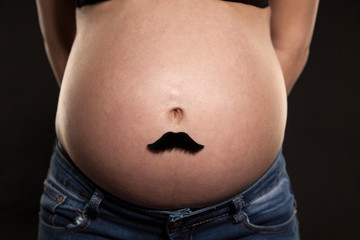 Unrecognizable woman with pregnancy tummy, future mother