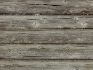 Fototapeta premium texture of cracks and dry pattern on the surface of old wooden logs