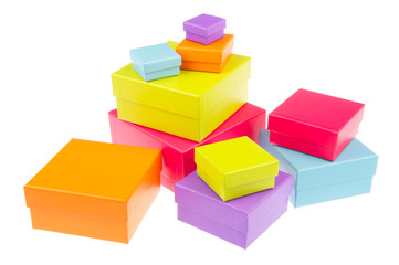 Stack of colorful gift boxes standing on white background