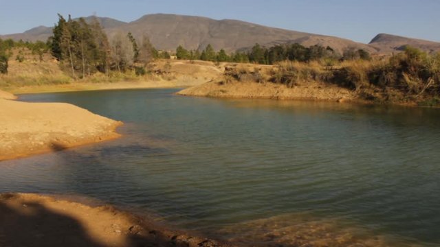 View of the andean mountains and a lake in first plan