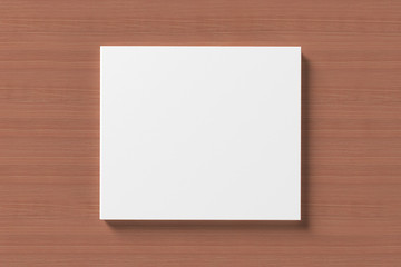 Blank compact disk cover on wooden background