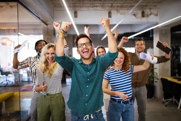 Foto op Aluminium Happy business people celebrating success at company © NDABCREATIVITY
