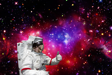 Astronaut against deep space. The elements of this image furnished by NASA.