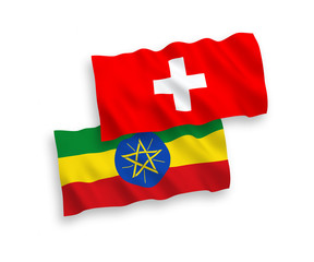 Flags of Ethiopia and Switzerland on a white background