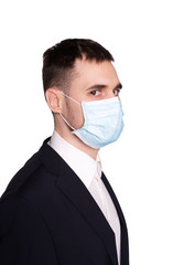 A young man in a medical mask with a scared face.
