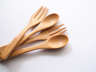Wooden spoon and fork isolated on white background