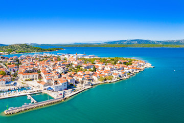 Fototapeta na wymiar Croatia, Adriatic coastline, beautiful seascape on island of Murter and town of Betina from air, popular touristic destination