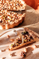 Slice of nut cake, five kinds of nuts, vegetarian dessert. Macro shooting.