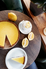 Lemon cheesecake, shop cafe, still life with coffee. Business background.