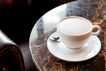 Cup of cocoa in cafe on table. Hot drinks background.