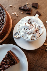 Chocolate cake cafe, nut cake with caramel. Coffee pause.