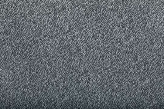 grey leather skin texture closeup. useful as gray background for design. High resolution photo
