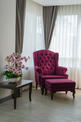 Luxury antique classic wooden armchair with burgundy velvet interior decoration