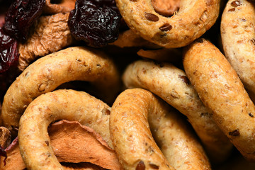 food as a background - whole grain wheat bagels with dried fruits