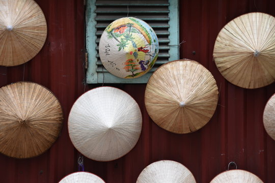 Vietnamese N&oacute;n L&aacute; Conical Hats Hanging on Wall, Hanoi 