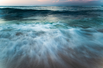 Scenic seascape. Waterscape for background. Slow shutter speed. Soft focus. Bingin beach, Bali