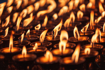 Burning candles in Buddhist temple