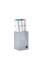 gray stand with felt-tip pens white background home-made concrete multicolor