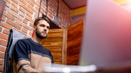 Handsome young programmer working in office. Developing programming and coding technologies.